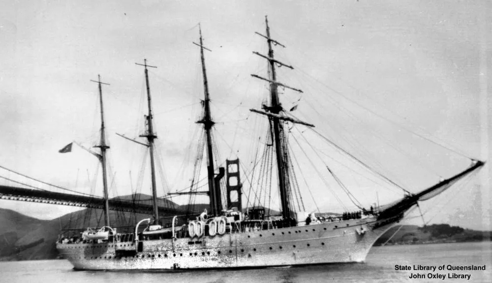 Black-and-white photograph of the Brazilian Navy training ship Almirante Saldanha, three-masted with auxiliary engines, in port.